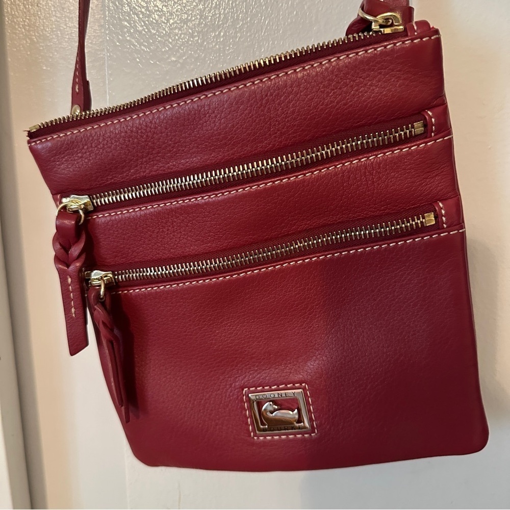 Red leather pebble Triple Zip Crossbody Dooney & Bourke bag with gold hardware